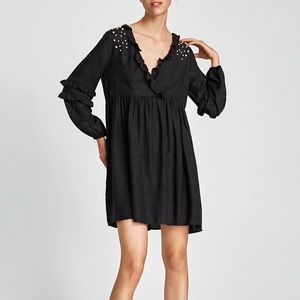 DRESS WITH CROSSOVER NECKLINE AND PEARL BEADS